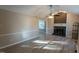 Bright living room featuring a fireplace and hardwood floors at 248 Southgate Dr, Garner, NC 27529