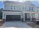 Charming two-story home with a two car garage and inviting front porch at 250 Tidal Pool Way, Cary, NC 27519