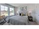 Spacious bedroom with large windows and plush bedding at 265 Sweetbay Tree Dr, Wendell, NC 27591