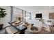 Bright dining area with a stylish table setting and views of the living room at 265 Sweetbay Tree Dr, Wendell, NC 27591