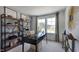Home office with built-in shelving and large windows at 265 Sweetbay Tree Dr, Wendell, NC 27591