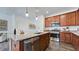 Open kitchen with island, stainless steel appliances, and hardwood floors at 265 Sweetbay Tree Dr, Wendell, NC 27591