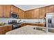 Modern kitchen with stainless steel appliances and granite countertops at 265 Sweetbay Tree Dr, Wendell, NC 27591