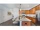 Open concept kitchen with island and stainless steel appliances at 265 Sweetbay Tree Dr, Wendell, NC 27591