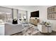Bright living room features stylish furniture, a large TV, and plenty of natural light at 265 Sweetbay Tree Dr, Wendell, NC 27591