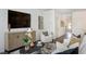 Spacious living room with a large TV, comfortable seating, and hardwood floors at 265 Sweetbay Tree Dr, Wendell, NC 27591
