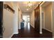 Dark hardwood floors, barn door, and view into living area at 2706 Nassau Trace, Fuquay Varina, NC 27526