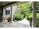 Peaceful back porch path leading to a wooded area at 292 Stoneview, Pittsboro, NC 27312