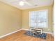 Simple bedroom with hardwood floors and a window at 3027 Maple Ave # Apt B2, Burlington, NC 27215