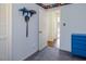 Blue bedroom boasts built-in shelving with toys and a sword, and a view to the hallway at 326 W Bywood Dr, Durham, NC 27712
