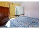 Comfortable bedroom featuring colorful walls, a four-poster bed, and hardwood floors at 326 W Bywood Dr, Durham, NC 27712