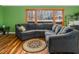 Comfortable living area featuring a large sectional sofa and a view of the outdoor scenery at 326 W Bywood Dr, Durham, NC 27712