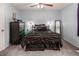 This large bedroom has a ceiling fan and beautiful lamps for perfect lighting at 326 W Bywood Dr, Durham, NC 27712