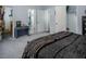 Large primary bedroom has gray carpet, doorway to bathroom, and walk-in closet at 326 W Bywood Dr, Durham, NC 27712