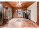 Cozy sunroom with brick accents, tile flooring, and natural light, perfect for relaxation at 326 W Bywood Dr, Durham, NC 27712