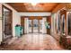 Sunroom with brick walls, tiled floor and backyard access at 326 W Bywood Dr, Durham, NC 27712