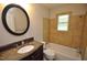 Updated bathroom with granite vanity and a tiled shower/tub at 326 Webster St, Cary, NC 27511
