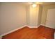 Hardwood floor bedroom with ceiling fan and ample natural light at 326 Webster St, Cary, NC 27511