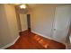 Hardwood floor bedroom with ceiling fan and ample natural light at 326 Webster St, Cary, NC 27511