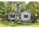 Charming gray house with stone accents and a manicured lawn at 326 Webster St, Cary, NC 27511