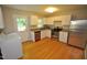Kitchen features stainless steel appliances and wood flooring at 326 Webster St, Cary, NC 27511