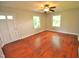 Bright living room featuring hardwood floors and a ceiling fan at 326 Webster St, Cary, NC 27511
