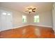 Bright living room featuring hardwood floors and a ceiling fan at 326 Webster St, Cary, NC 27511