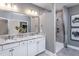 Bathroom with double vanity, granite countertop, and walk-in shower at 334 Arcadius Dr, Clayton, NC 27520