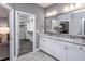 Bathroom features a double vanity, granite countertop, and access to a large walk-in closet at 334 Arcadius Dr, Clayton, NC 27520