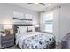 Bright bedroom with a queen-size bed and natural light from a large window at 334 Arcadius Dr, Clayton, NC 27520