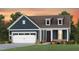 Charming craftsman style home with a two-car garage and landscaped yard at 334 Arcadius Dr, Clayton, NC 27520