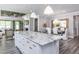 Modern kitchen with white cabinets, granite countertops, and an island at 334 Arcadius Dr, Clayton, NC 27520
