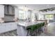 Modern kitchen with white cabinets, granite countertops, and stainless steel appliances at 334 Arcadius Dr, Clayton, NC 27520