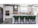 Modern kitchen with white cabinets, granite countertops, and stainless steel appliances at 334 Arcadius Dr, Clayton, NC 27520