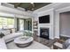 Spacious living room with hardwood floors, fireplace, and built in shelving at 334 Arcadius Dr, Clayton, NC 27520