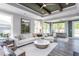 Spacious living room with hardwood floors, a cozy fireplace and large windows at 334 Arcadius Dr, Clayton, NC 27520