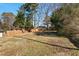 Large backyard with wooden fence and mature trees at 3817 Booker Ave, Durham, NC 27713
