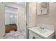 Clean bathroom with white vanity and tiled floor at 3817 Booker Ave, Durham, NC 27713