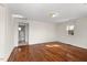Hardwood floor bedroom with access to bathroom at 3817 Booker Ave, Durham, NC 27713
