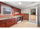 Kitchen offers wood cabinets, access to backyard at 3817 Booker Ave, Durham, NC 27713
