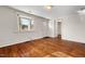 Living room with hardwood floors and bay window at 3817 Booker Ave, Durham, NC 27713