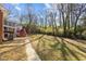 Large backyard with trees and walkway at 420 Nelson St, Durham, NC 27707