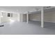 Finished basement with gray epoxy floor and high ceilings at 420 Nelson St, Durham, NC 27707