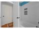 Updated bathroom with a white bathtub and tiled shower at 420 Nelson St, Durham, NC 27707