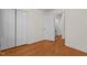 Hardwood floor bedroom with double door closet and hallway view at 420 Nelson St, Durham, NC 27707