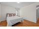 Bedroom with hardwood floors, queen bed, and window at 420 Nelson St, Durham, NC 27707