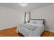 Bright bedroom with hardwood floors and large window at 420 Nelson St, Durham, NC 27707