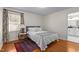 Cozy bedroom with hardwood floors and ensuite bathroom access at 420 Nelson St, Durham, NC 27707