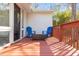 Relaxing deck with blue chairs and a wicker table at 420 Nelson St, Durham, NC 27707