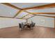 Sunlit dining room features hardwood floors and wood beam ceiling at 420 Nelson St, Durham, NC 27707